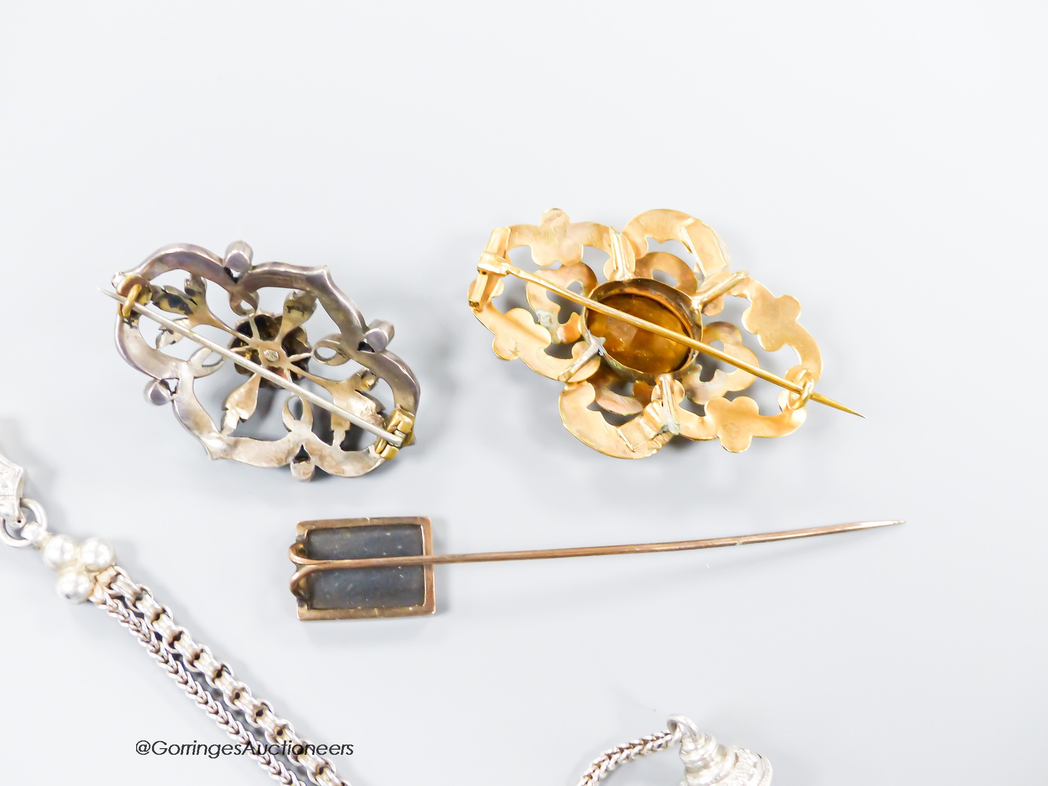 A George V silver albertina, 27cm, an Edwardian yellow metal and citrine brooch, a turquoise and seed pearl brooch and a yellow metal and pietra dura set stick pin.